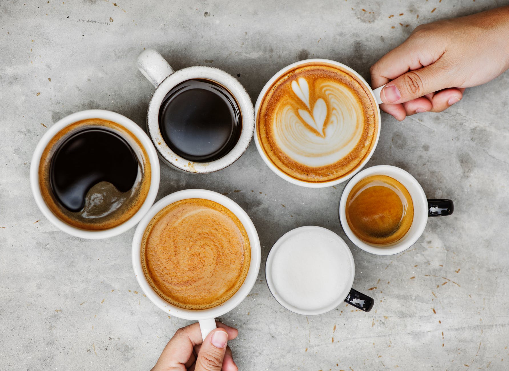 six white ceramic mugs